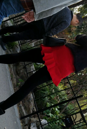 Black jacket is red short skirt